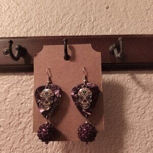 SUGAR SKULLS METAL CHARMS ON PURPLE GUITAR PICK EARRINGS